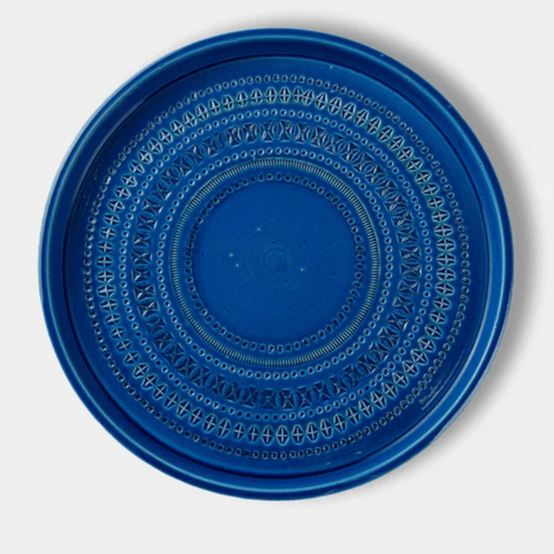 The Bitossi Centro Large is a handcrafted Italian ceramic centrepiece bowl designed by Aldo Londi. Finished in the signature Rimini Blu turquoise glaze with engraved stencil detailing, this decorative bowl showcases exceptional craftsmanship and the timeless design heritage of the Bitossi archive.