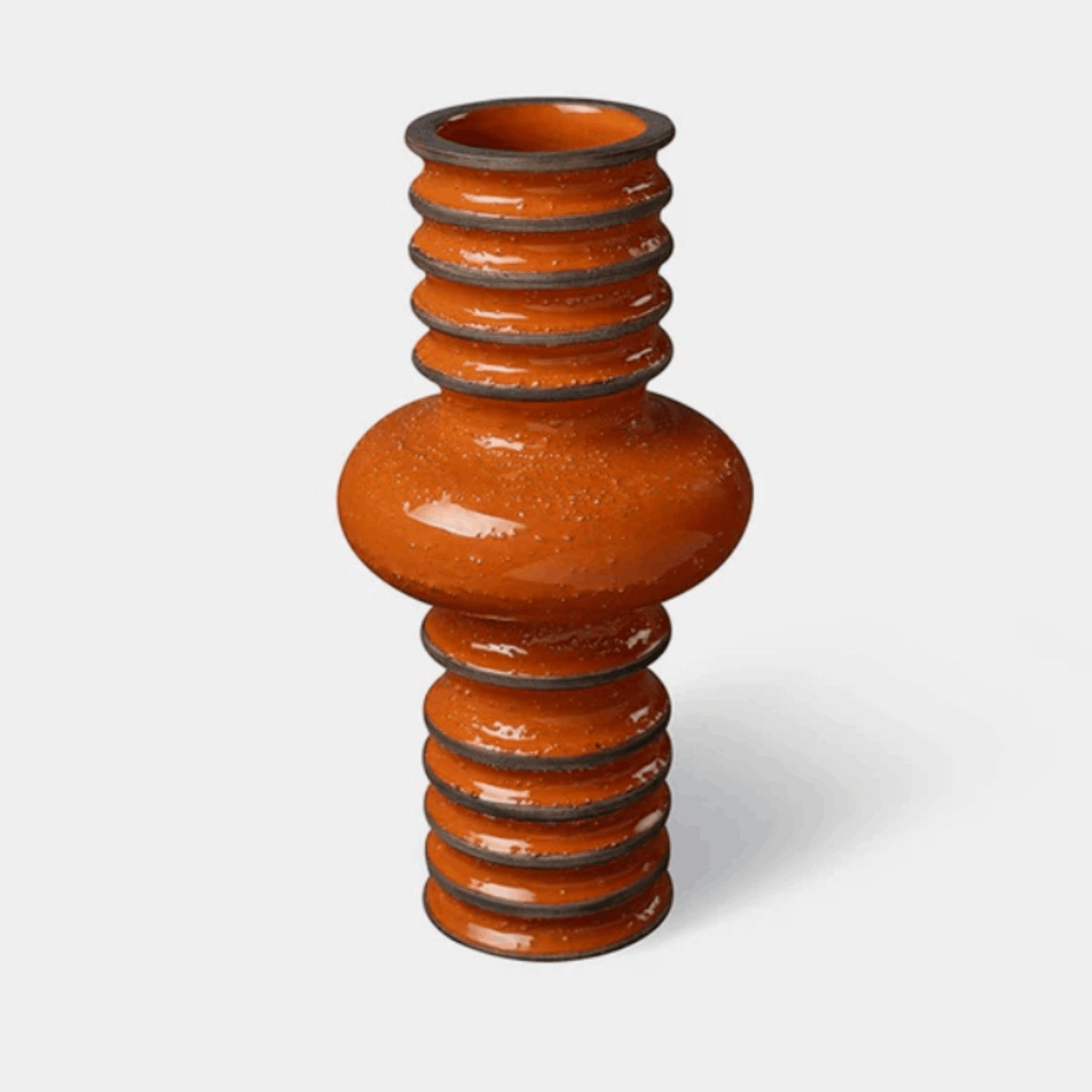 The Bitossi Bomba Vase by Christoph Radl is a handcrafted ceramic vase from the Revolver Collection. Featuring a bold spiralled silhouette, textured sand-infused finish and glossy crystalline glaze, it brings sculptural character and contemporary Italian design to shelves, consoles and dining tables.