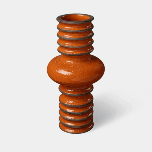 The Bitossi Bomba Vase by Christoph Radl is a handcrafted ceramic vase from the Revolver Collection. Featuring a bold spiralled silhouette, textured sand-infused finish and glossy crystalline glaze, it brings sculptural character and contemporary Italian design to shelves, consoles and dining tables.