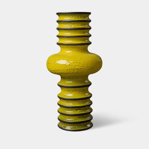 The Bitossi Bomba Vase by Christoph Radl is a handcrafted ceramic vase from the Revolver Collection. Featuring a bold spiralled silhouette, textured sand-infused finish and glossy crystalline glaze, it brings sculptural character and contemporary Italian design to shelves, consoles and dining tables.