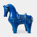 The Bitossi Figura Cavallo Medium is a handcrafted Italian ceramic horse sculpture designed by Aldo Londi. Finished in the signature Rimini Blu turquoise glaze, this iconic decorative piece showcases sculptural form, exceptional craftsmanship and the enduring design heritage of the renowned Bitossi archive.