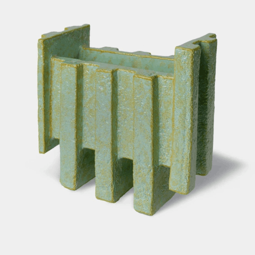 The Bitossi Patricia Urquiola Merlate Large Green Vase is a sculptural ceramic vase crafted from white clay and finished in a rich green glaze. Featuring an architectural textured surface, asymmetric silhouette and contrasting rim, it creates a bold decorative statement for shelves, consoles, dining tables and modern interiors.