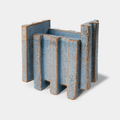 The Bitossi Patricia Urquiola Merlate Medium Blue Vase is a sculptural ceramic vase crafted from white clay and finished in a rich blue glaze. Featuring an architectural textured surface and asymmetric silhouette, it creates a striking decorative centrepiece for shelves, consoles, dining tables and contemporary interiors.