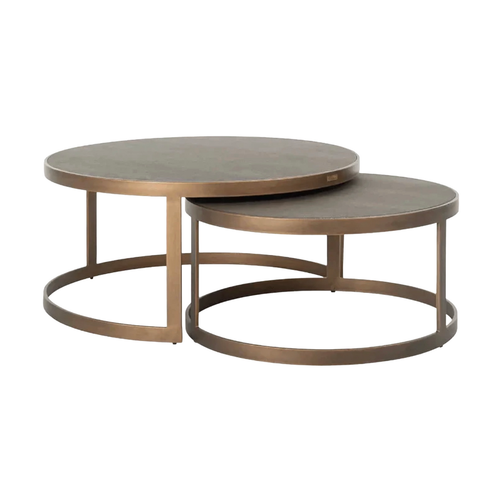 Set of two round bronze coffee tables on a white background