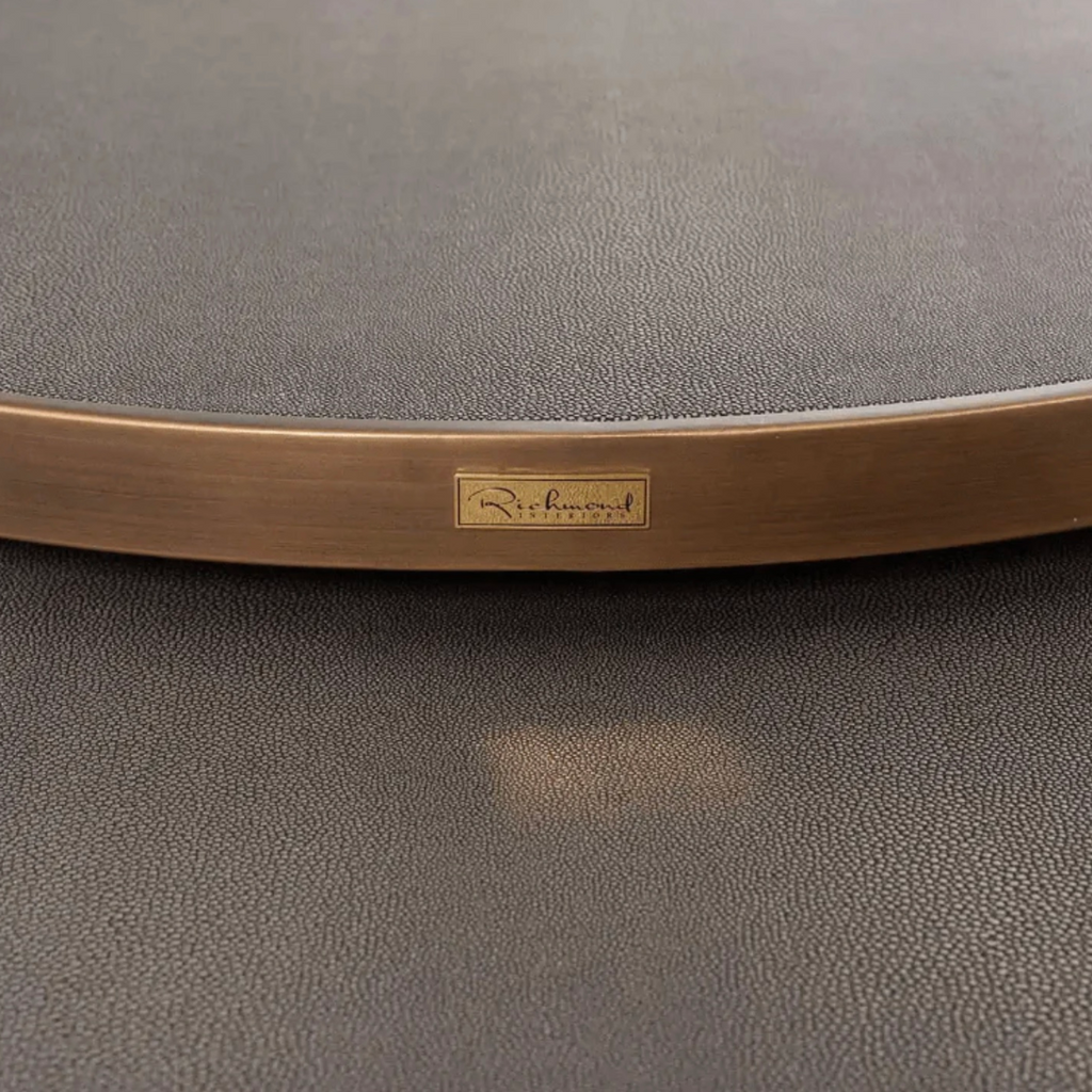 Close up of the Bloomingville coffee table top. Brass frame with faux segrine leather top