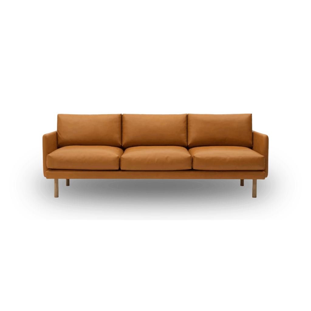 Scandinavian leather sofa with oak frame, Oeko-Tex certified cushions, and handcrafted Danish design by Bruunmunch.