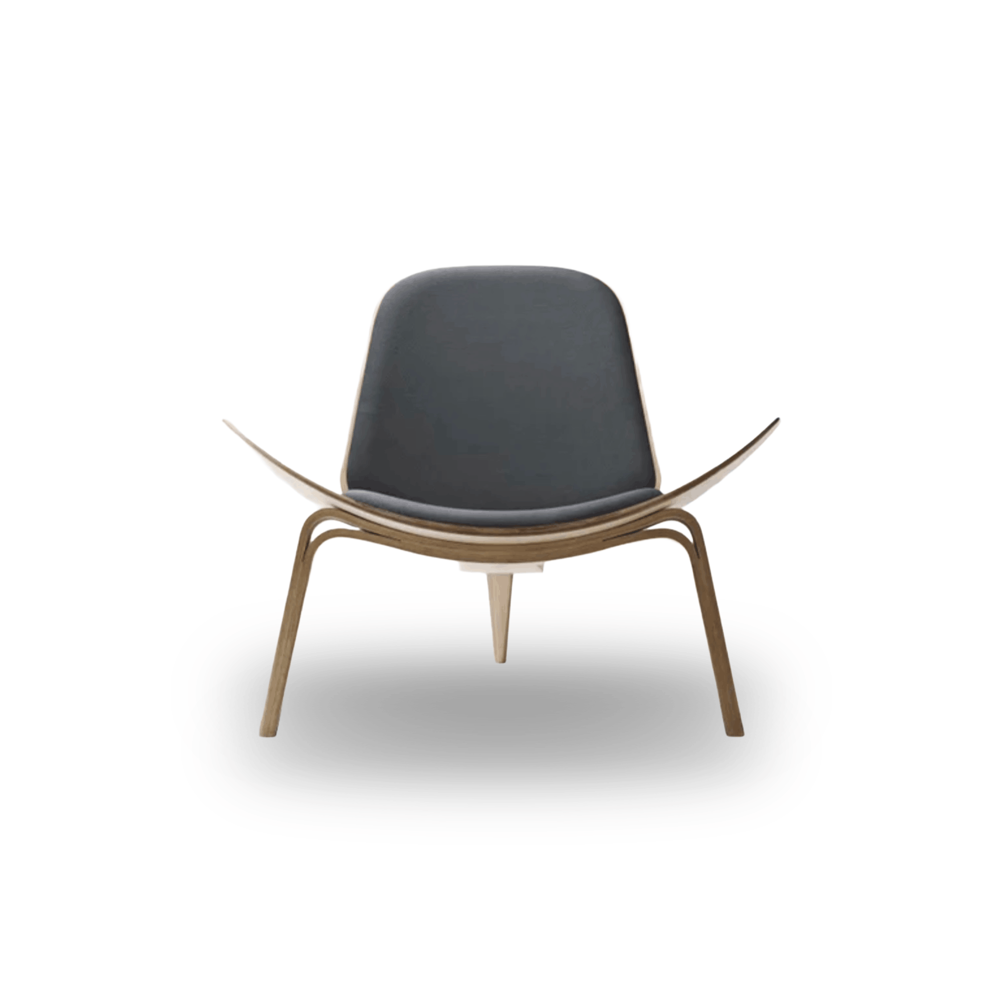 Designed by Hans J. Wegner, the CH07 Shell Chair features a form-pressed veneer shell, leather upholstery, and iconic Scandinavian styling.