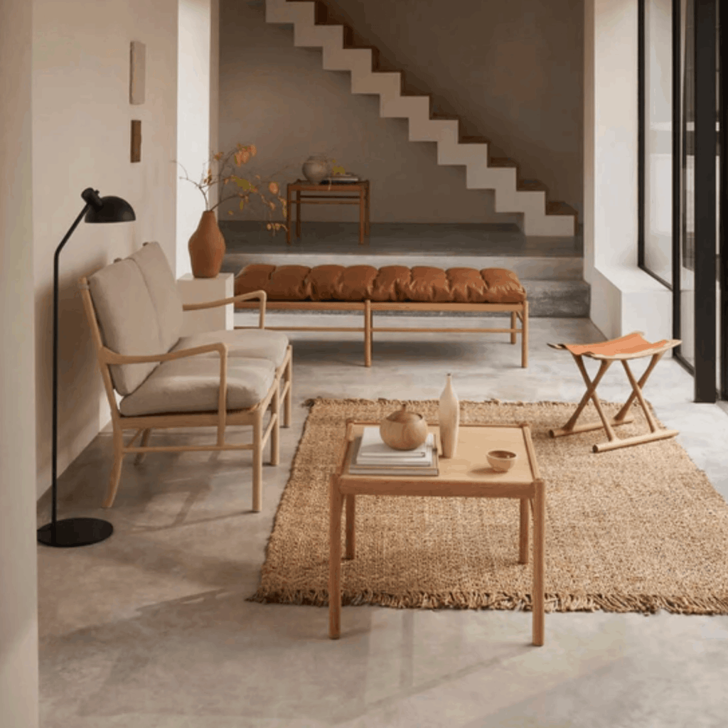 A beautifully crafted oak sofa with soft Re-wool upholstery, bringing understated luxury and enduring comfort to contemporary interiors. 