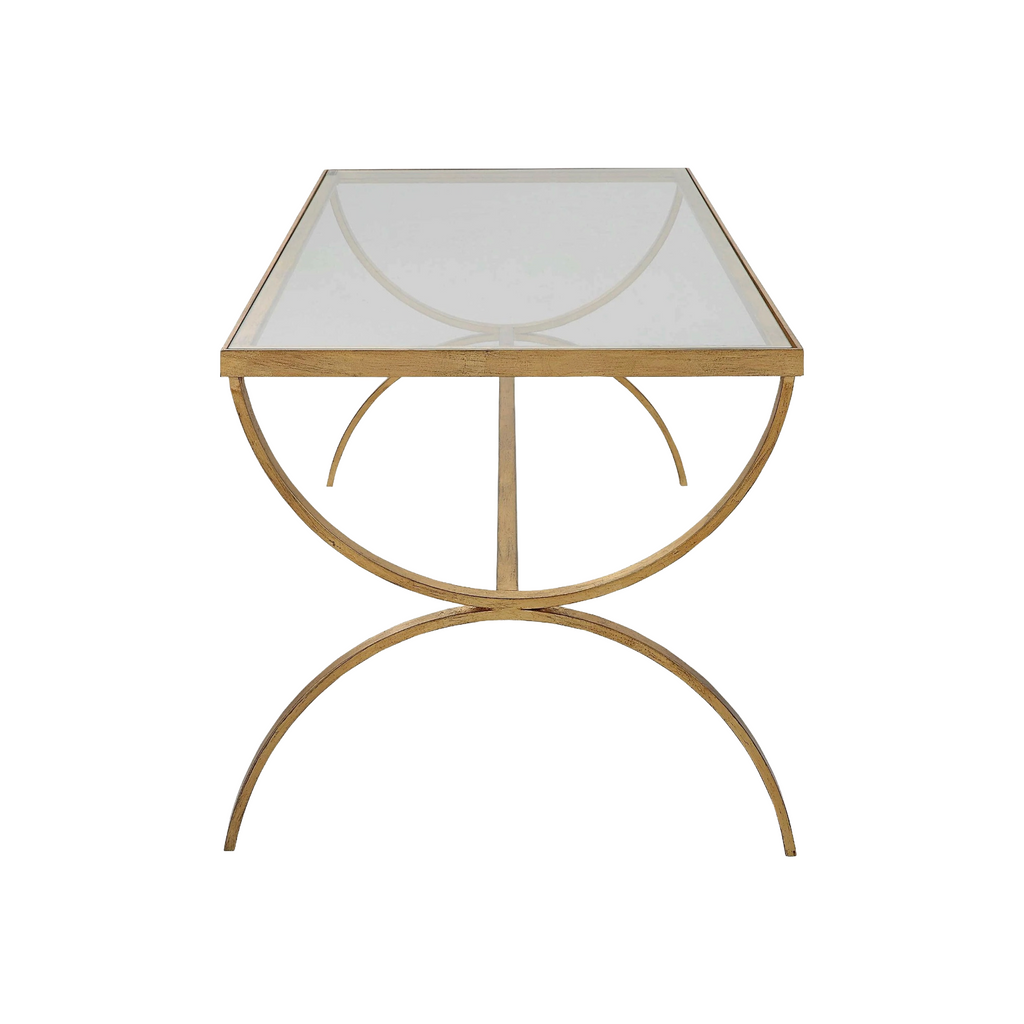 Elegant crescent coffee table featuring hand-forged iron in antique gold with tempered glass top, ideal for modern living rooms.