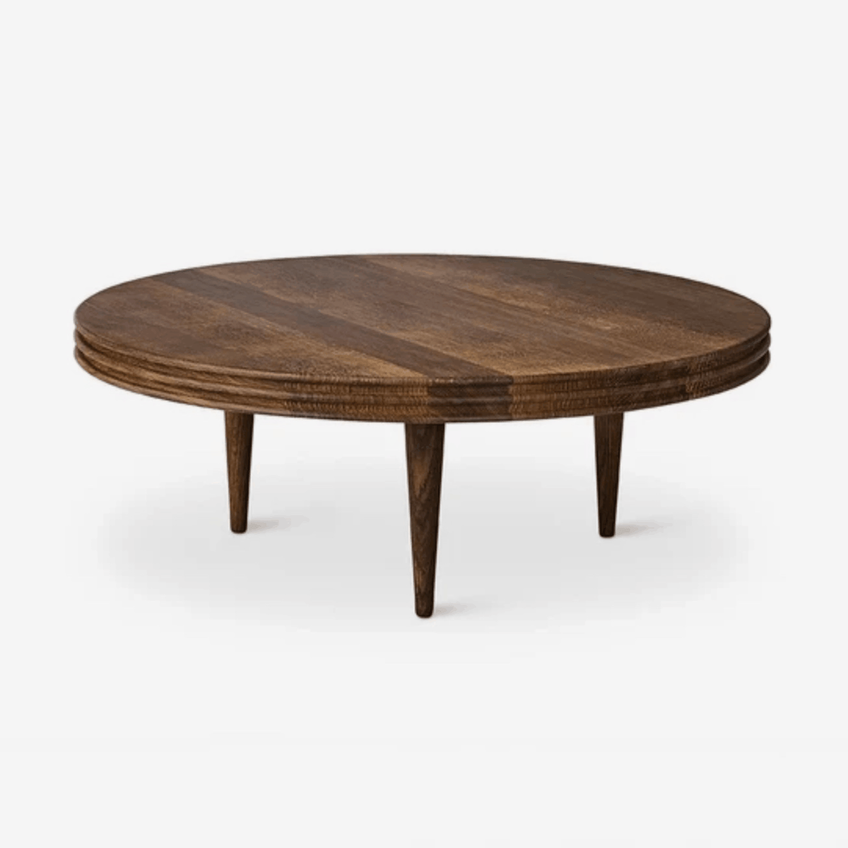 DK3 Groove Round Coffee Table in walnut with a thick circular tabletop, finely milled grooved edge and slender conical wooden legs.
