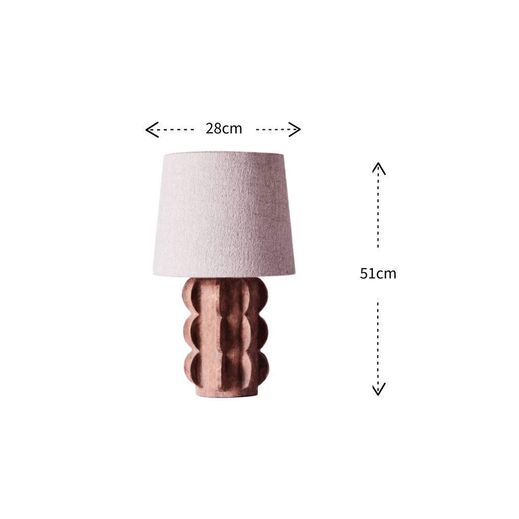 A table lamp with a textured light pink fabric shade and a scalloped metallic rose-gold base, shown with dimension arrows indicating a width of 28cm and a height of 51cm on a white background.
