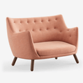 The Finn Juhl Poet Sofa in Walnut combines sculptural Danish design, luxurious upholstery and exceptional craftsmanship in an iconic two-seater sofa.