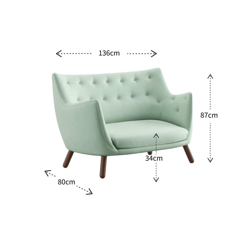 A light mint green tufted armchair with dark wooden legs, shown with dimension arrows and labels indicating width 136cm, height 87cm, and leg depth 34cm, plus a side width of 80cm, on a plain white background.