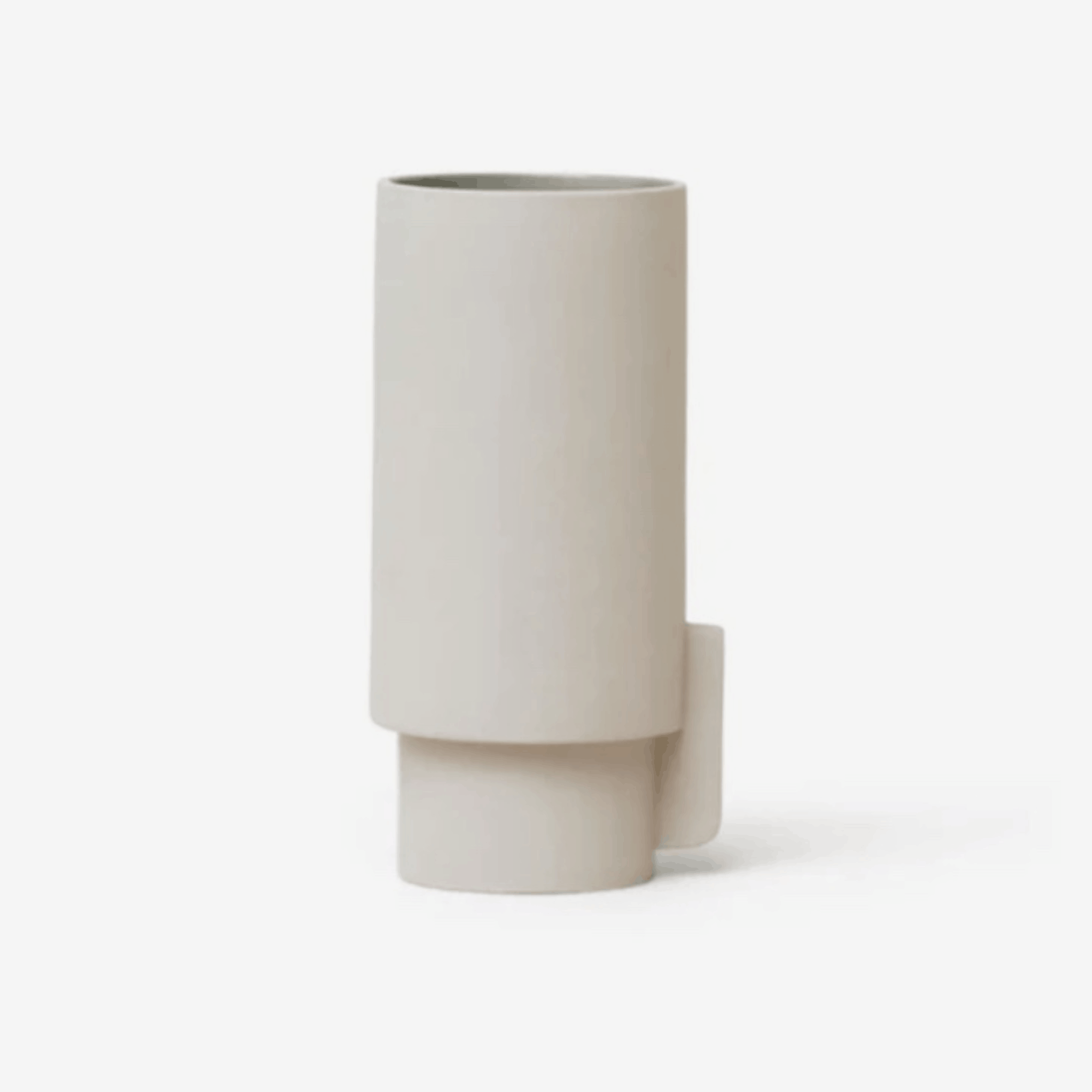 The Form & Refine Alcoa Vase is a handcrafted Portuguese stoneware vase designed by Herman Studio. Featuring a matt grey exterior, glossy grey glazed interior and clean Scandinavian lines, it makes an elegant centrepiece, decorative vase or stylish kitchen utensil holder.