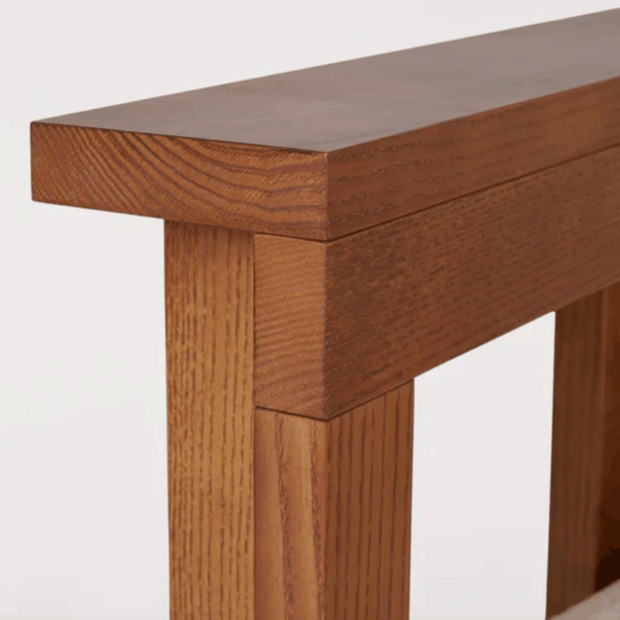 Close up of the Frama Symmetry Chair which features a solid ash frame.