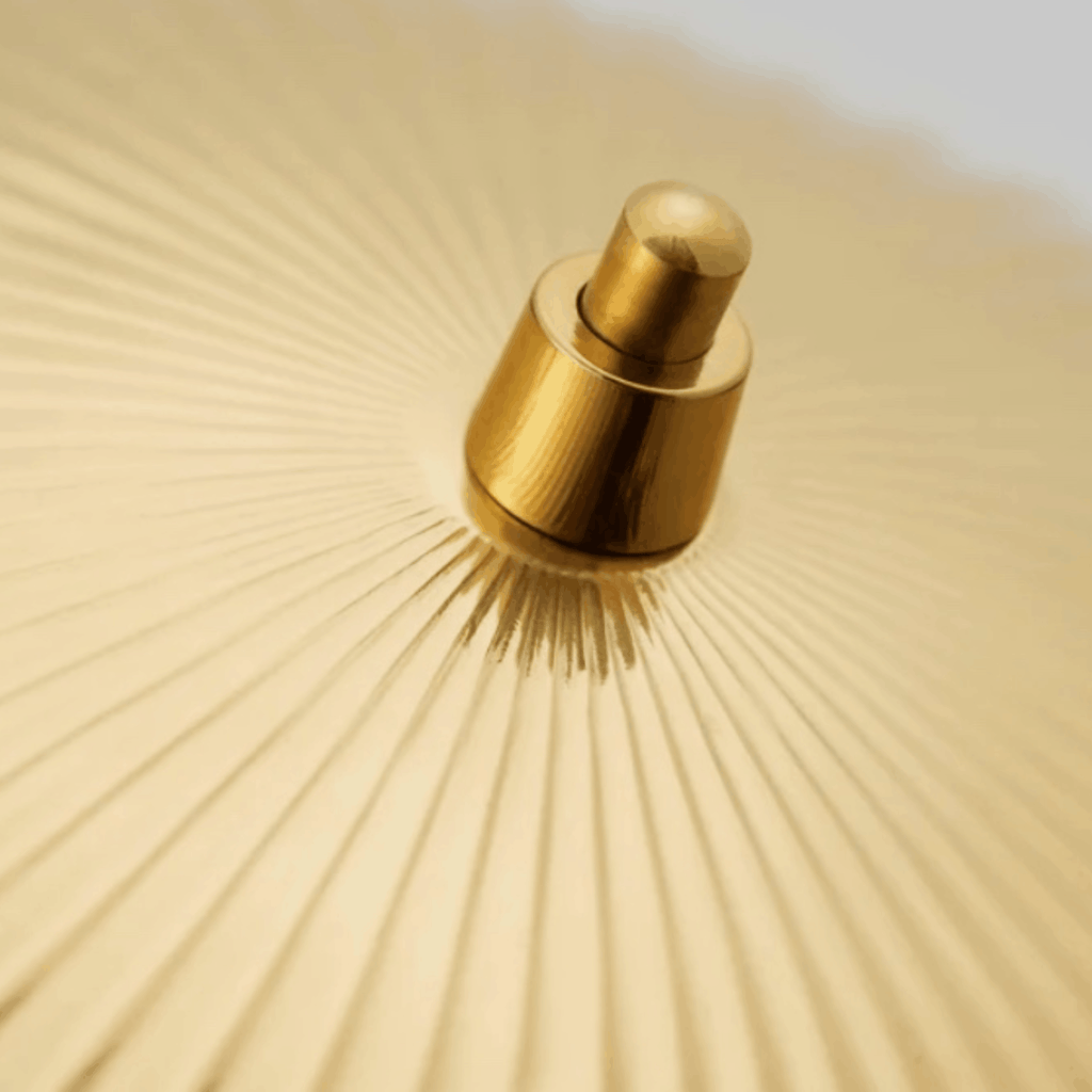 Close up of the shell pattern on the shade of the GUBI 5321 Table Lamp by Paavo Tynell with sculptural brass seashell shade and elegant Scandinavian design.