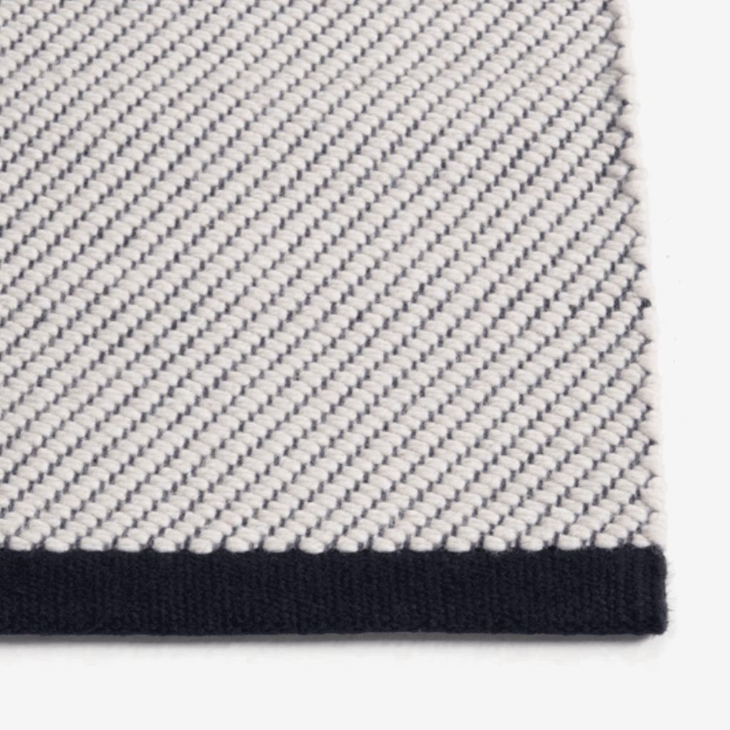 Contemporary wool rug by HAY with a refined diagonal weave, two-tone effect, and OEKO-TEX® STANDARD 100 certification.