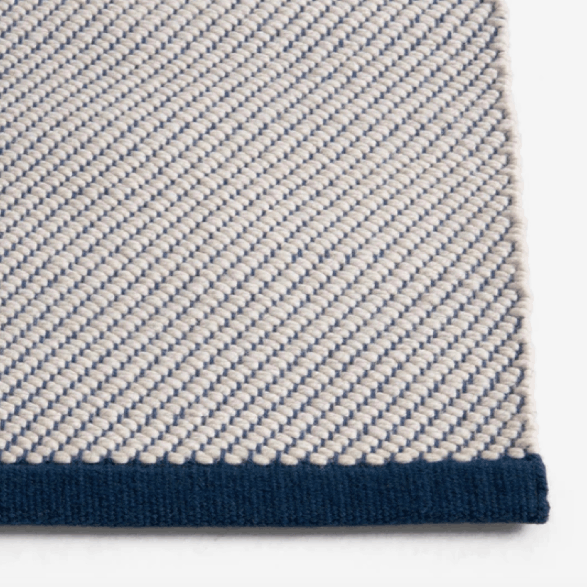 Contemporary wool rug by HAY with a refined diagonal weave, two-tone effect, and OEKO-TEX® STANDARD 100 certification.
