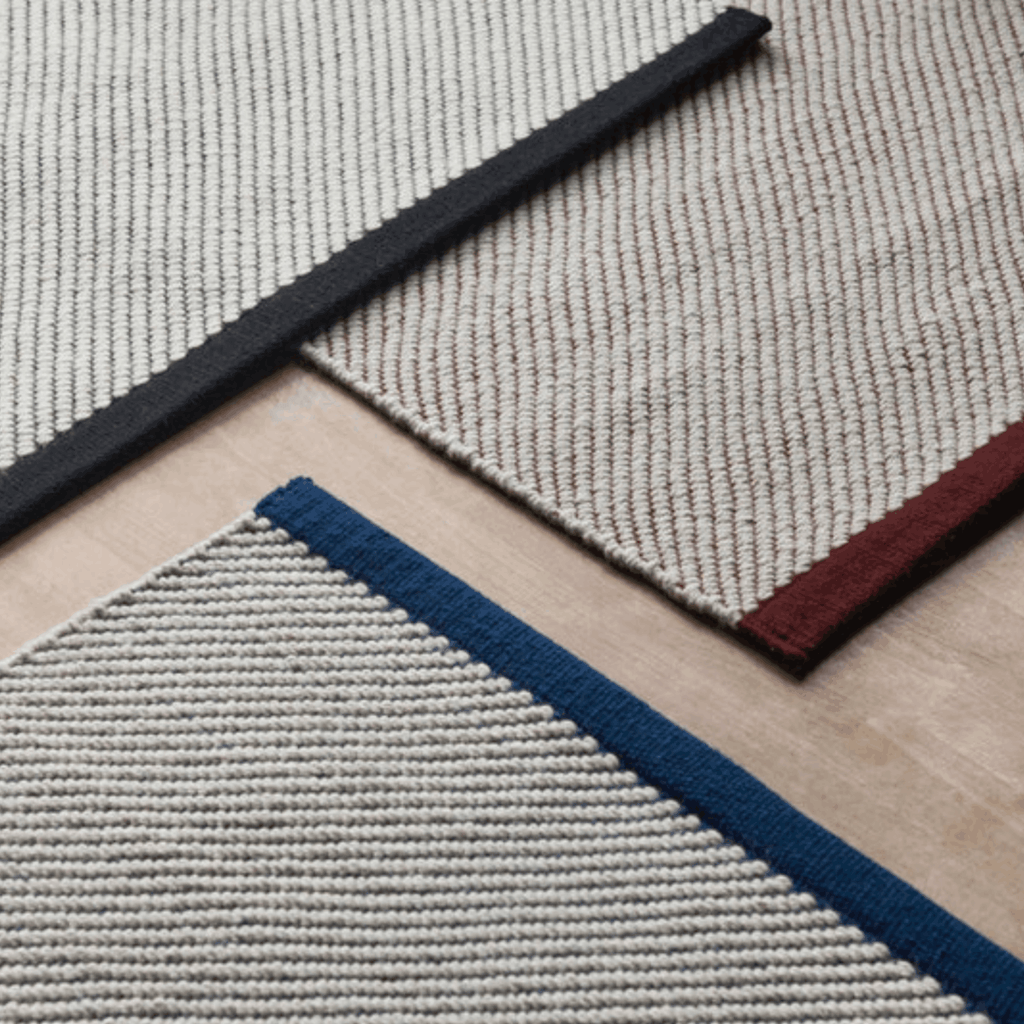 Contemporary wool rugs by HAY with a refined diagonal weave, two-tone effect, and OEKO-TEX® STANDARD 100 certification.