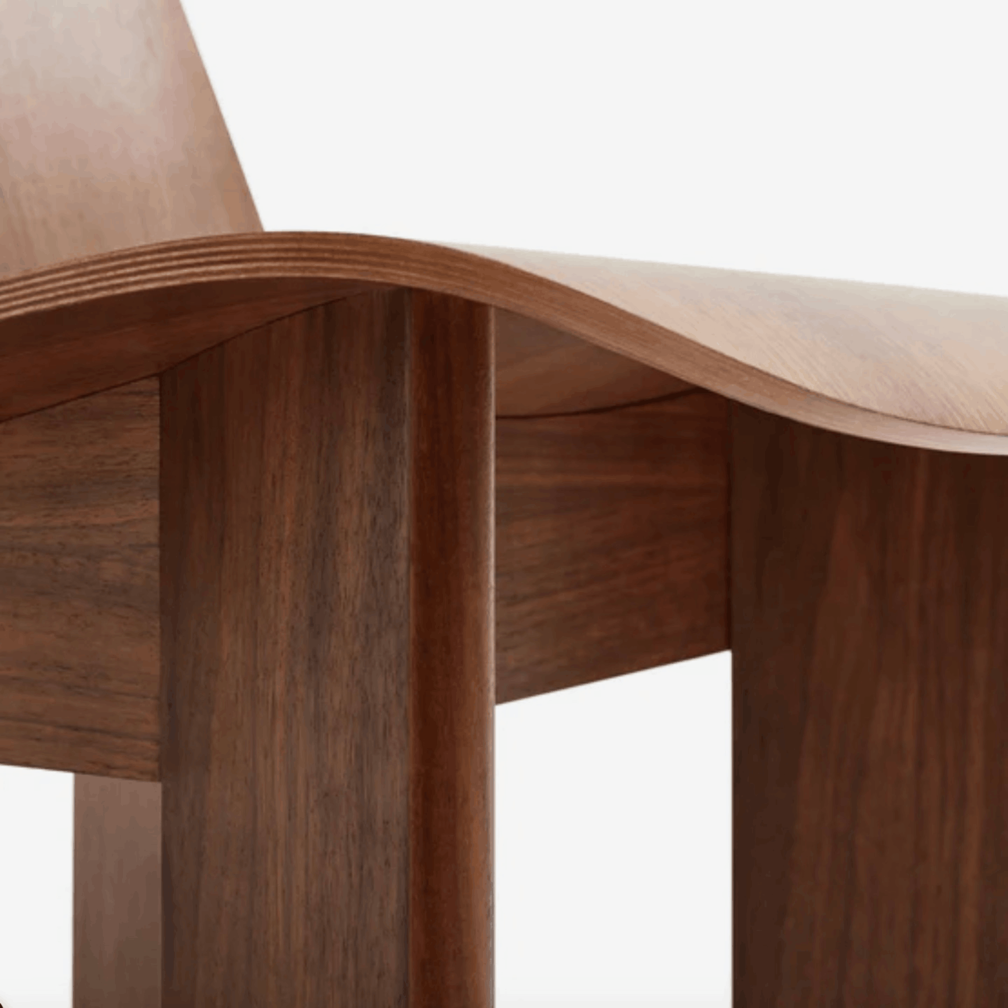 Wooden chair with a curved backrest on a white background
