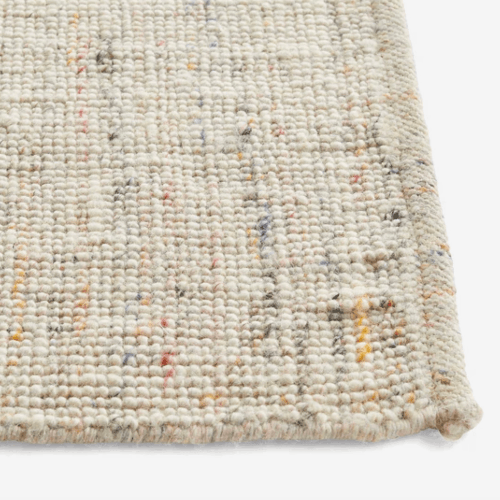 Contemporary HAY rug crafted from New Zealand wool and viscose, featuring a refined neutral weave with delicate multicoloured accents.