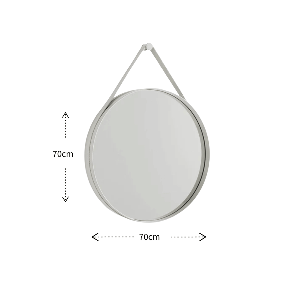 A contemporary round wall mirror by HAY featuring a minimalist steel strap design, perfect for bedrooms, bathrooms, and hallways.