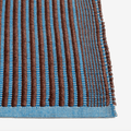 Handwoven by HAY, the Tapis Rug features a durable jute and cotton blend with a non-slip backing for modern living spaces.