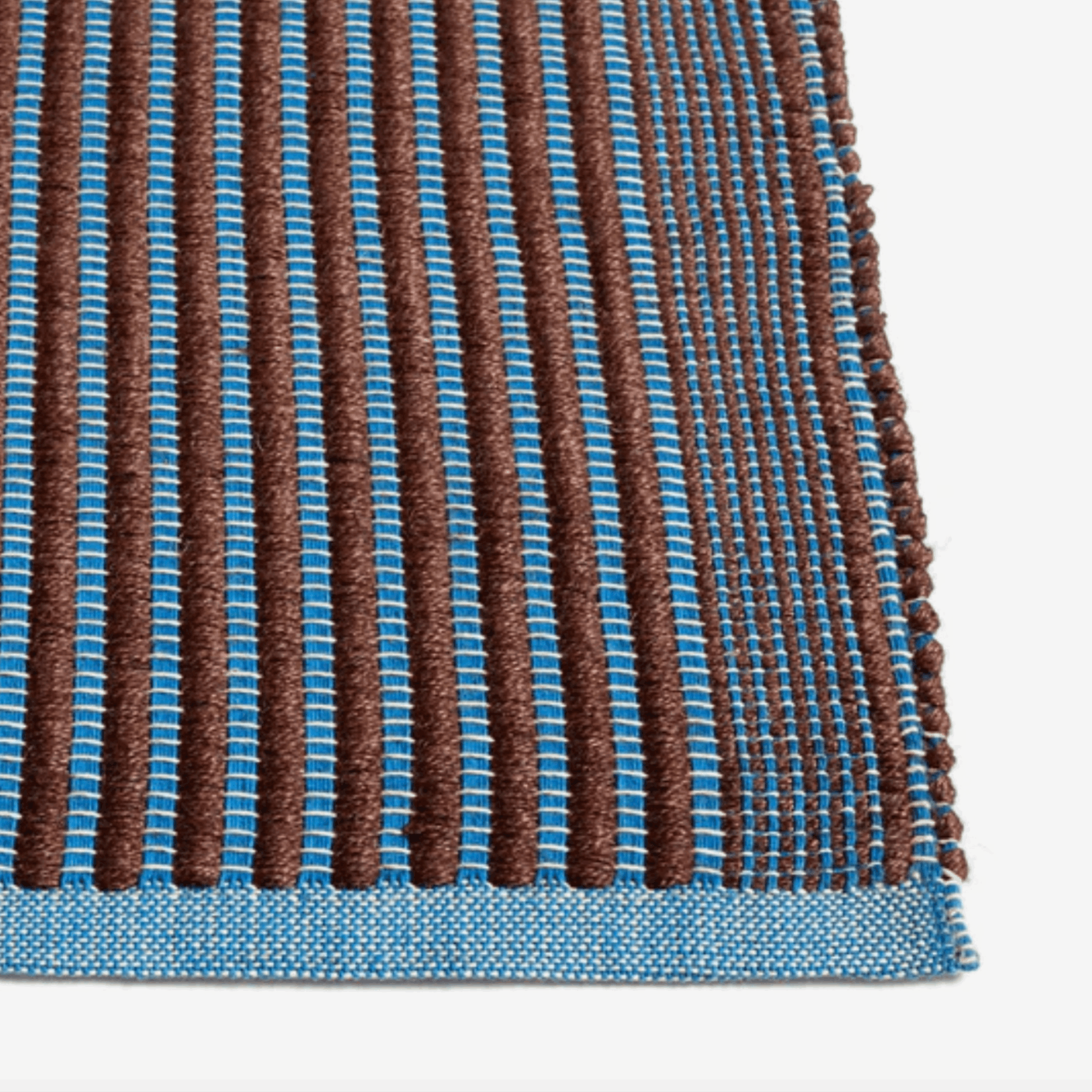 Handwoven by HAY, the Tapis Rug features a durable jute and cotton blend with a non-slip backing for modern living spaces.