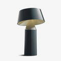 The Marset Bicoca Portable Rechargeable Lamp by Christophe Mathieu is a cordless designer LED table lamp featuring a tiltable shade, touch dimming, USB charging and warm 2700K illumination. Its lightweight, portable design makes it ideal for modern living spaces, bedrooms and reading corners.