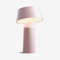 The Marset Bicoca Portable Rechargeable Lamp by Christophe Mathieu is a cordless designer LED table lamp featuring a tiltable shade, touch dimming, USB charging and warm 2700K illumination. Its lightweight, portable design makes it ideal for modern living spaces, bedrooms and reading corners.