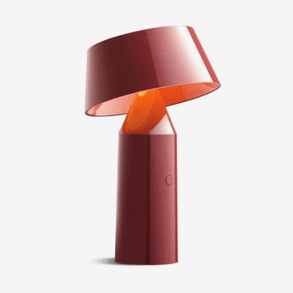 The Marset Bicoca Portable Rechargeable Lamp by Christophe Mathieu is a cordless designer LED table lamp featuring a tiltable shade, touch dimming, USB charging and warm 2700K illumination. Its lightweight, portable design makes it ideal for modern living spaces, bedrooms and reading corners.