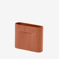 The Muuto Ridge Vase is a contemporary earthenware vase featuring a distinctive sculptural silhouette and innovative central indentation that supports floral arrangements while doubling as a practical handle. Its compact size makes it ideal for shelves, side tables, consoles and modern Scandinavian interiors.