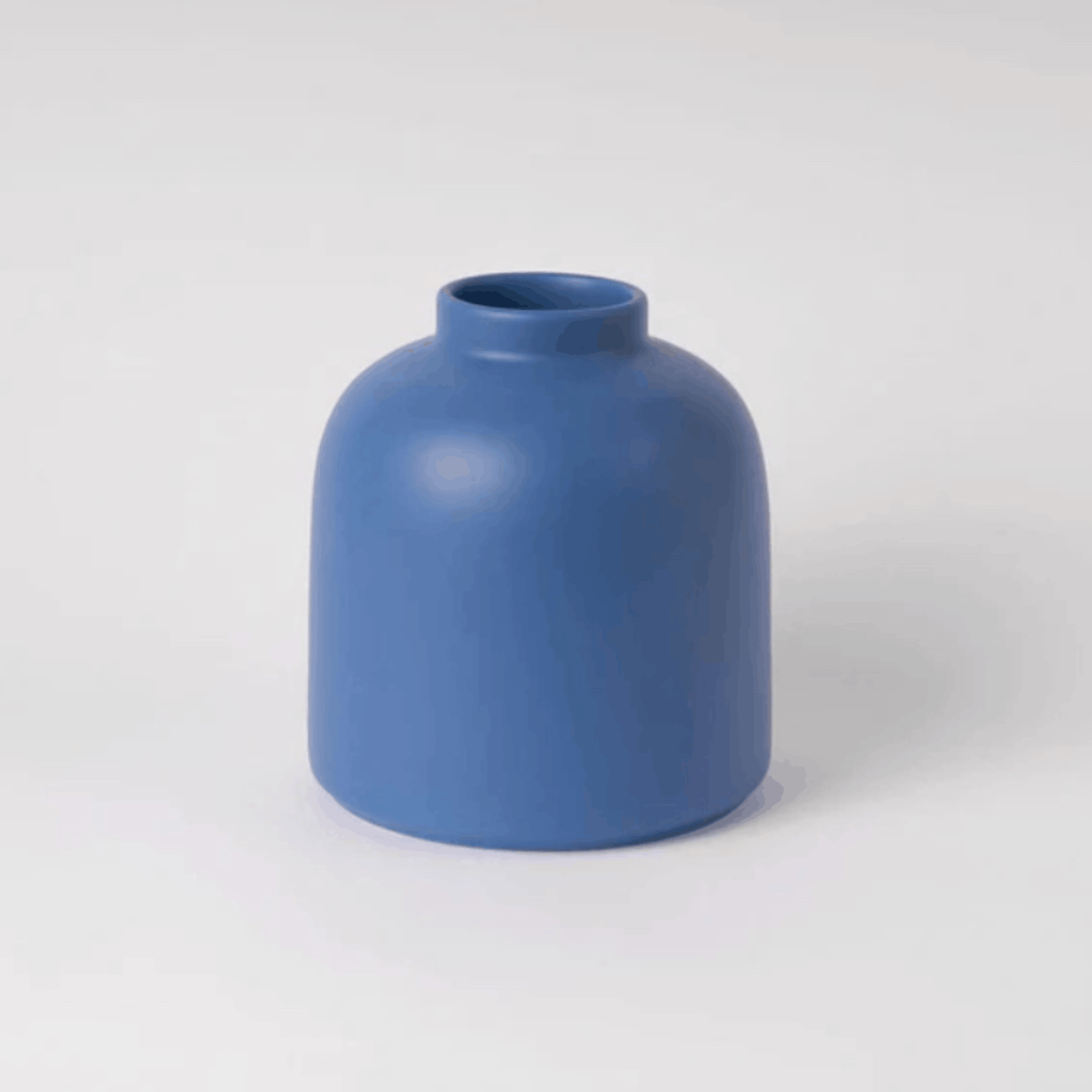 The Raawii Omar Vase is a handcrafted earthenware vase designed by Omar Sosa and made in Portugal. Featuring a sculptural silhouette and beautifully glazed finish, this contemporary decorative vase combines exceptional craftsmanship with modern Scandinavian-inspired design, making it an elegant statement piece for any interior.