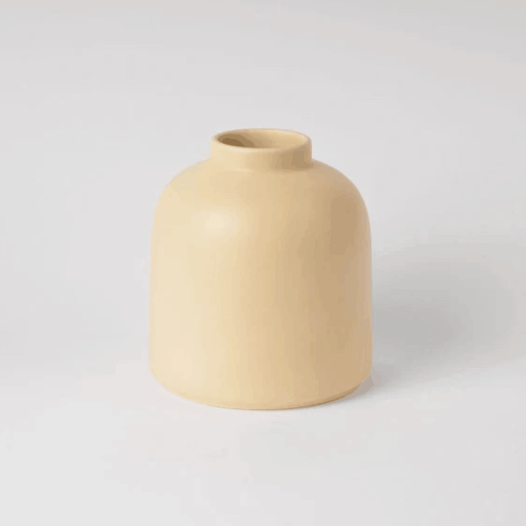The Raawii Omar Vase is a handcrafted earthenware vase designed by Omar Sosa and made in Portugal. Featuring a sculptural silhouette and beautifully glazed finish, this contemporary decorative vase combines exceptional craftsmanship with modern Scandinavian-inspired design, making it an elegant statement piece for any interior.