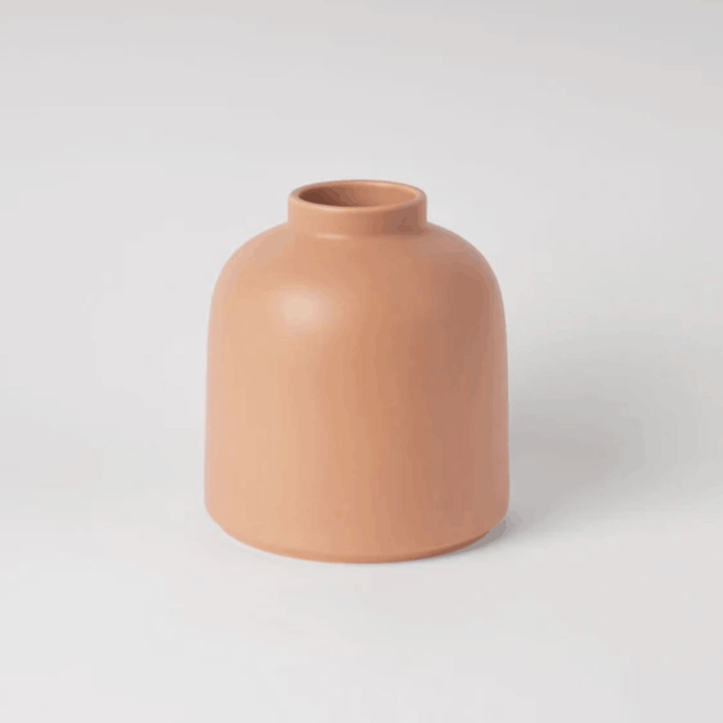 The Raawii Omar Vase is a handcrafted earthenware vase designed by Omar Sosa and made in Portugal. Featuring a sculptural silhouette and beautifully glazed finish, this contemporary decorative vase combines exceptional craftsmanship with modern Scandinavian-inspired design, making it an elegant statement piece for any interior.