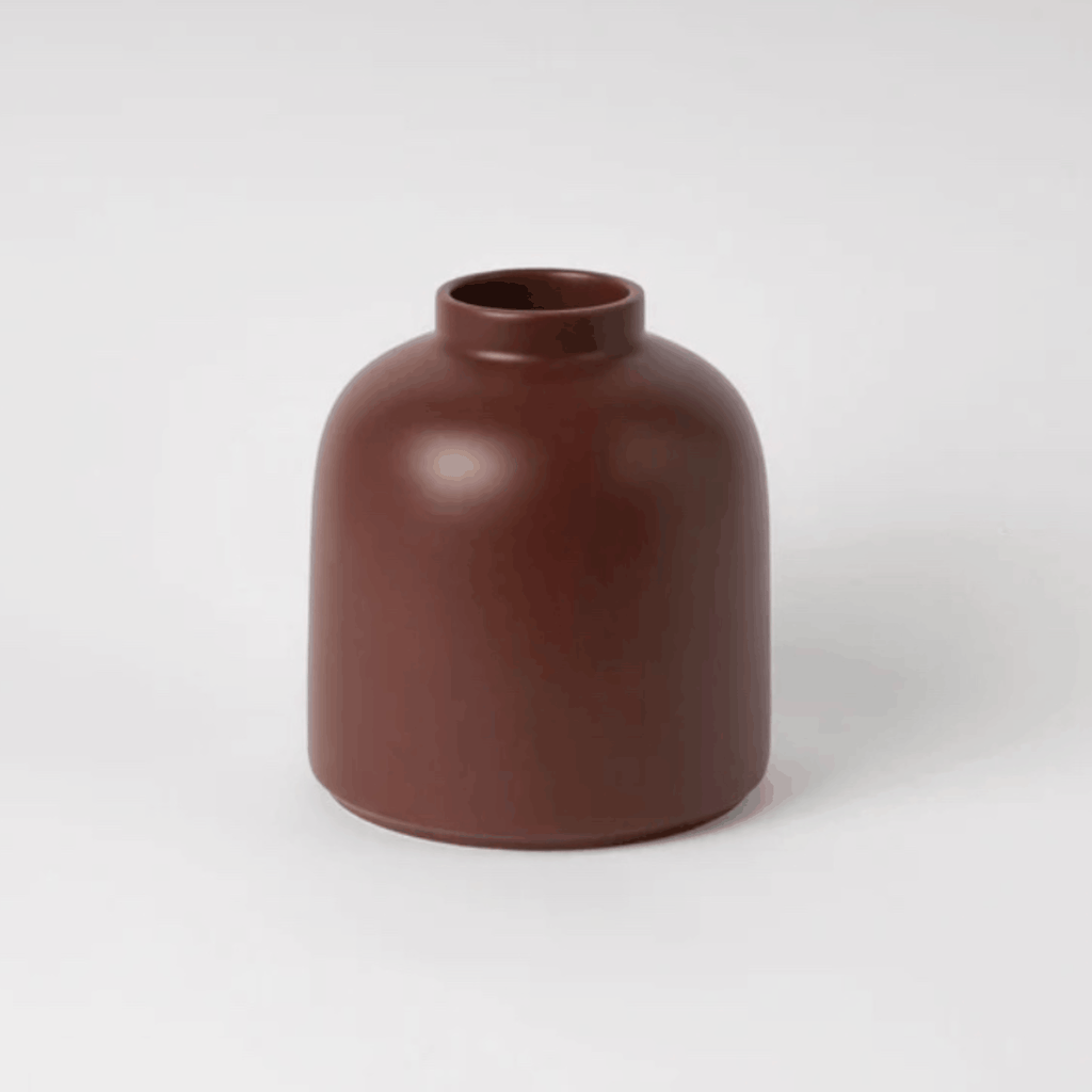The Raawii Omar Vase is a handcrafted earthenware vase designed by Omar Sosa and made in Portugal. Featuring a sculptural silhouette and beautifully glazed finish, this contemporary decorative vase combines exceptional craftsmanship with modern Scandinavian-inspired design, making it an elegant statement piece for any interior.