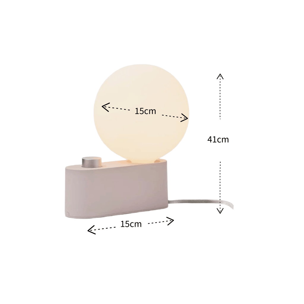 A small table lamp with a glowing oval globe on a rectangular base, shown with dimension arrows and labels indicating 15cm width, 15cm depth, and 41cm height on a white background.