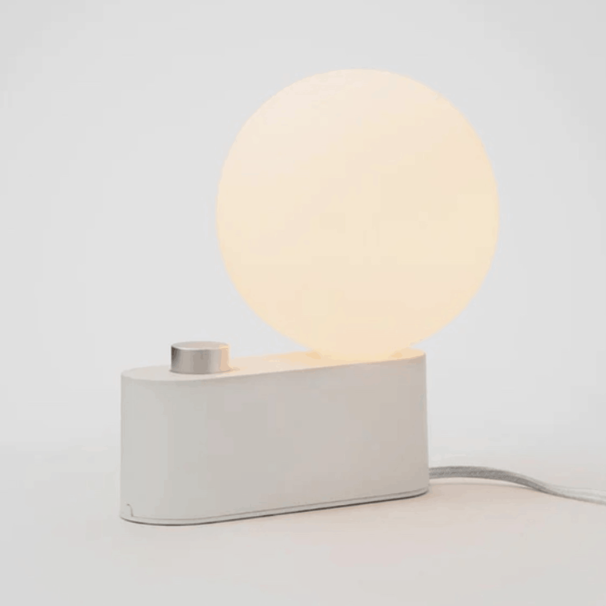 The Tala Alumina Table Lamp is a versatile 2-in-1 designer light that functions as both a table lamp and wall-mounted light. Featuring a minimalist metal construction, fabric cable and mains dimming compatibility, it brings flexible contemporary lighting to modern interiors.