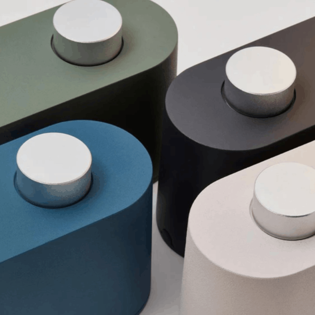 close up of The Tala Alumina Table Lamp is a versatile 2-in-1 designer light that functions as both a table lamp and wall-mounted light. 