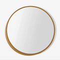 A modern round wall mirror with an architectural three-dimensional profile, designed by Sarah Rousselle for The Conran Shop.