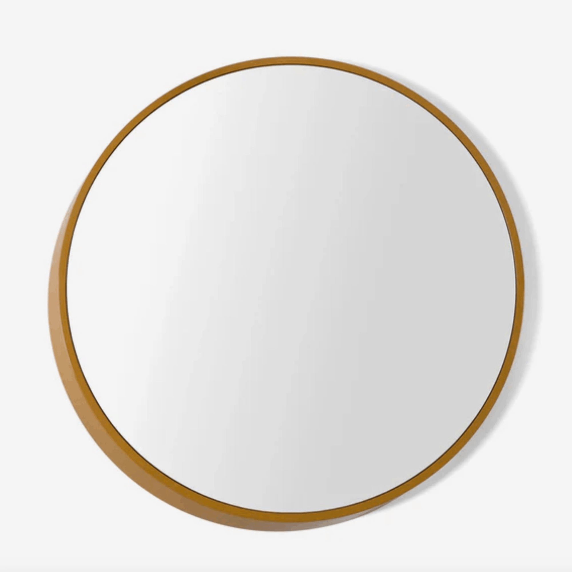 A modern round wall mirror with an architectural three-dimensional profile, designed by Sarah Rousselle for The Conran Shop.