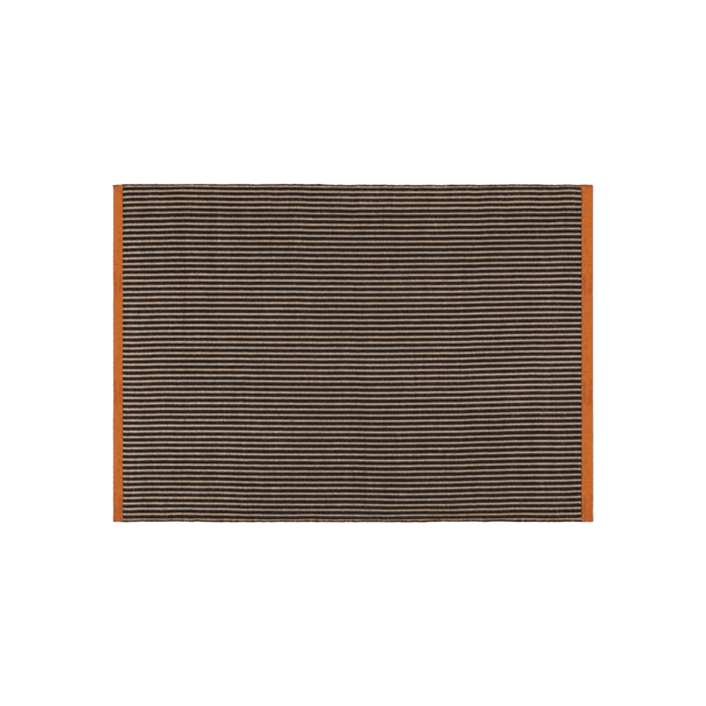Handcrafted in India, the Tom Dixon Line Rug features premium natural fibres, tactile woven textures, and timeless contemporary design.