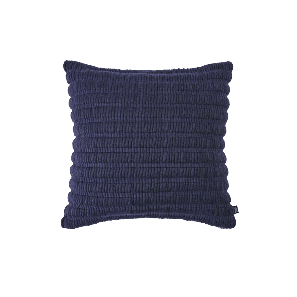Luxury decorative cushion by Tom Dixon, handcrafted from New Zealand wool and cotton with a textured ridged design.