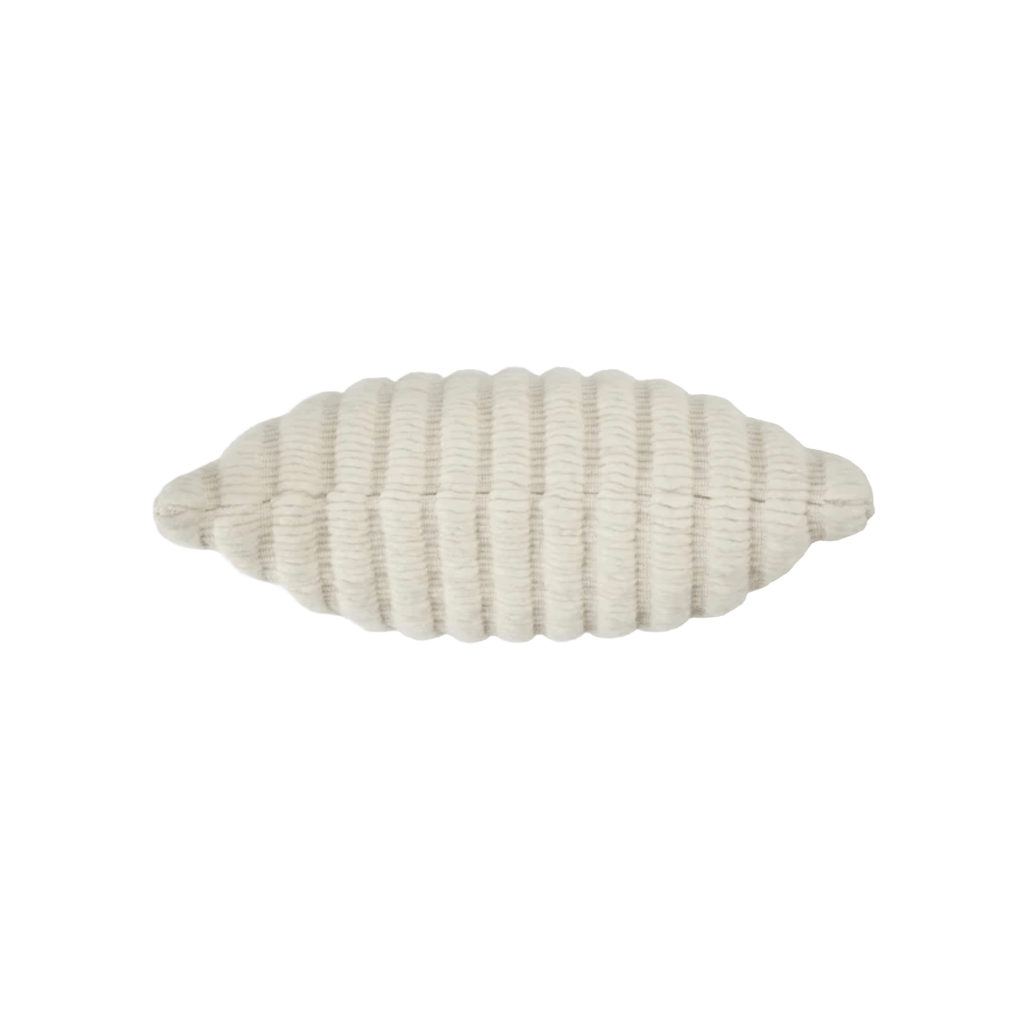 White ribbed decorative pillow on a white background