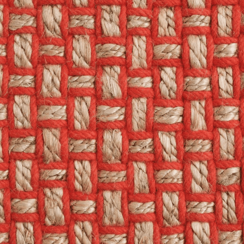 A close-up of a Tom Dixon woven textile pattern rug with bright orange twine interwoven with natural beige jute strands in a basketweave arrangement.