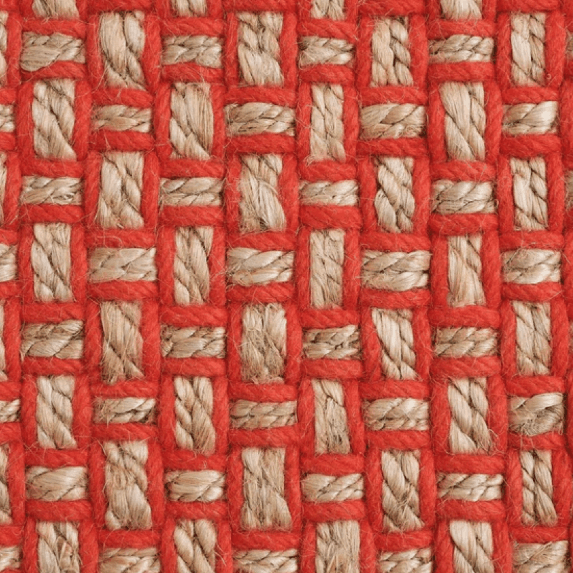 A close-up of a Tom Dixon woven textile pattern rug with bright orange twine interwoven with natural beige jute strands in a basketweave arrangement.