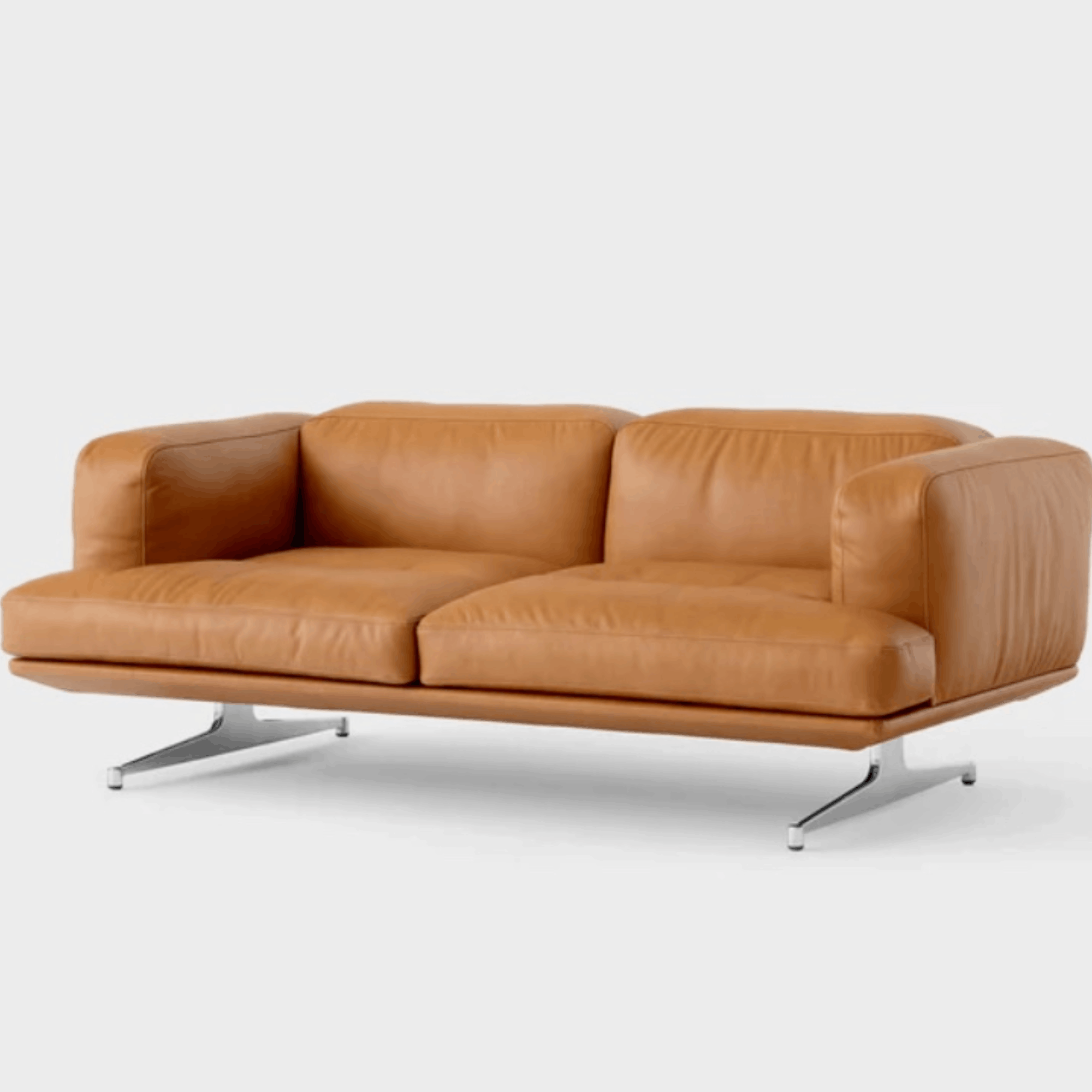 The &Tradition AV22 Inland 2 Seater Sofa combines Scandinavian elegance with luxurious cognac aniline leather, polished aluminium legs and exceptional everyday comfort.
