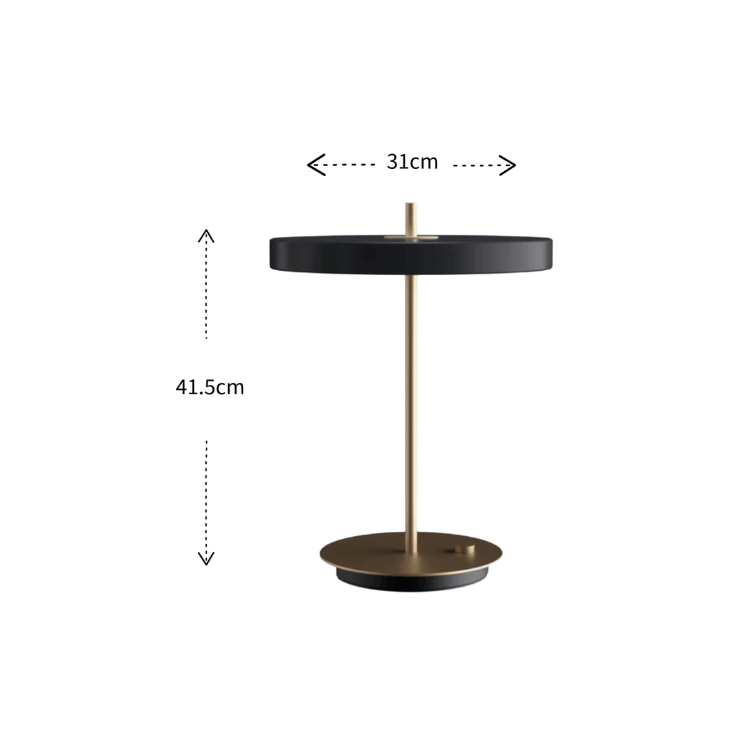 A modern table lamp with a matte black circular shade and base, supported by a slim brass-colored central pole, shown on a white background with dimension labels indicating 31 cm width and 41.5 cm height.