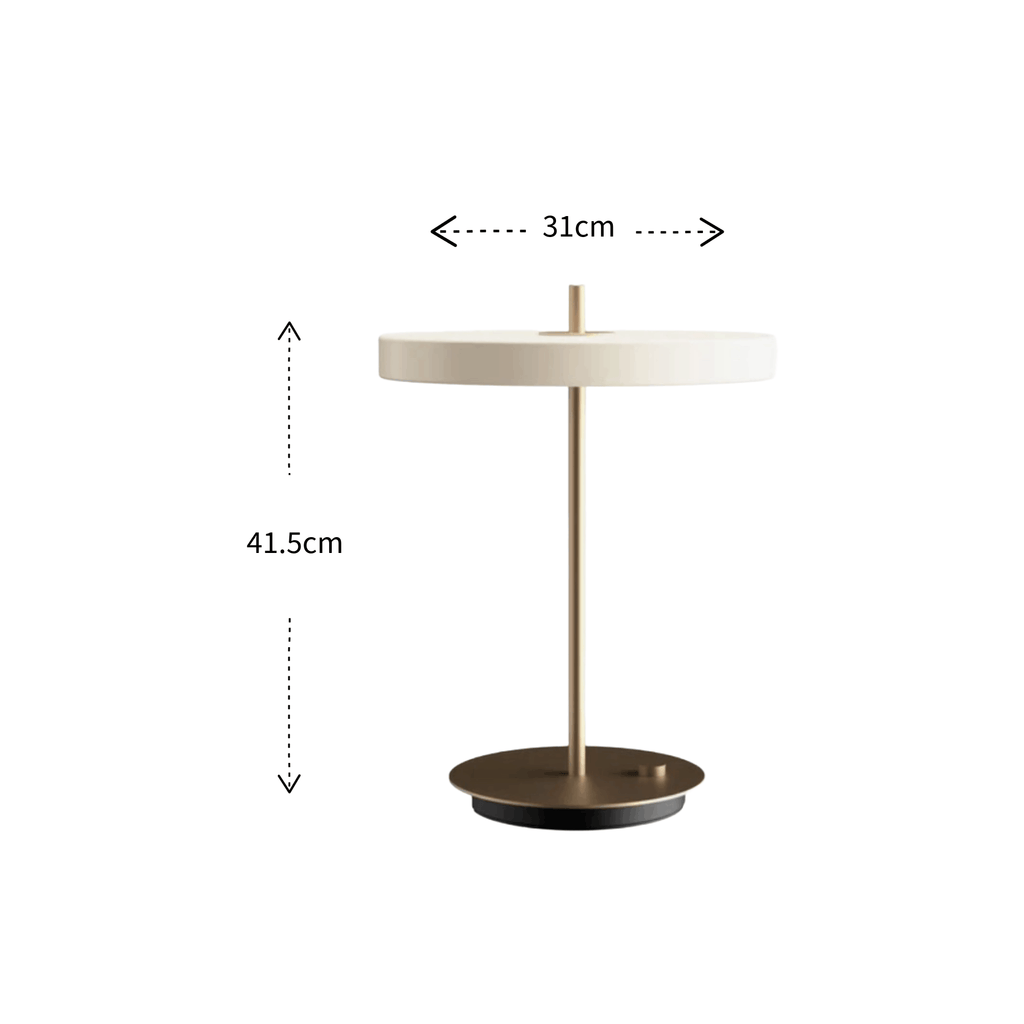 A modern table lamp with a round off-white shade, a slim brass-colored metal stem, and a circular bronze base, shown with dimension annotations indicating a height of 41.5cm and a width of 31cm.
