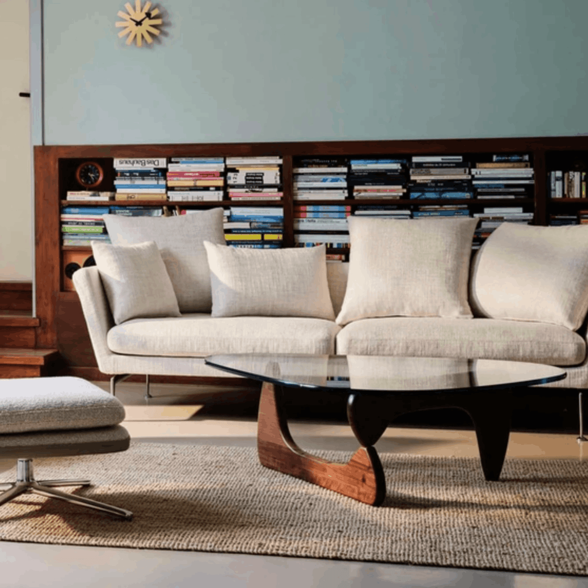Vitra Coffee Table by Isamu Noguchi in walnut with sculptural interlocking wooden base and curved clear glass top.
